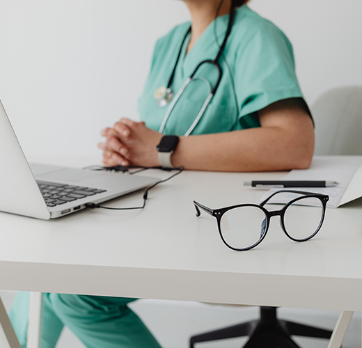 Medical profession sitting at a desk