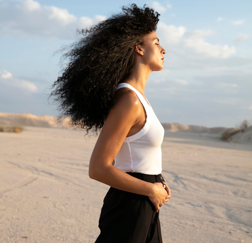 Women walking outdoors on the sand