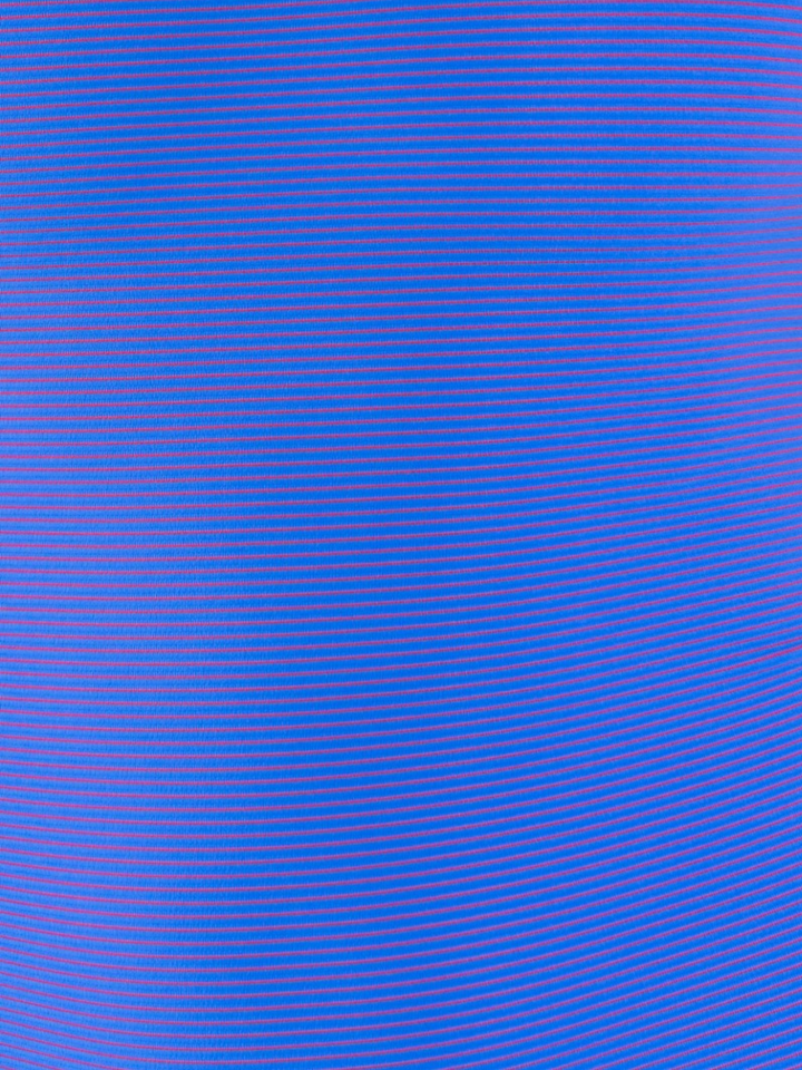 Close-up of post swim hot girl stripe fabric pattern blue background with thin pink pinstripe