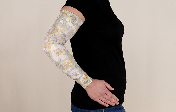 Person wearing a floral-patterned compression sleeve